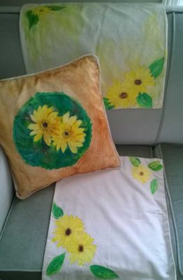 Set of two table mats and a cushion cover