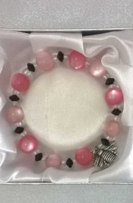 Pink, white and black beaded bracelet in box