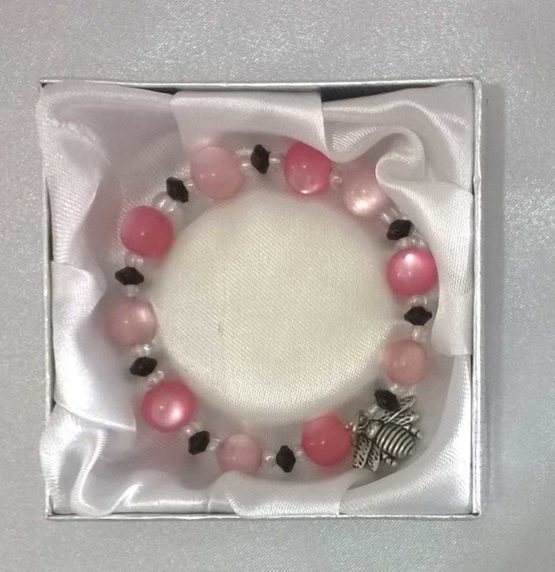 Pink, white and black beaded bracelet in box