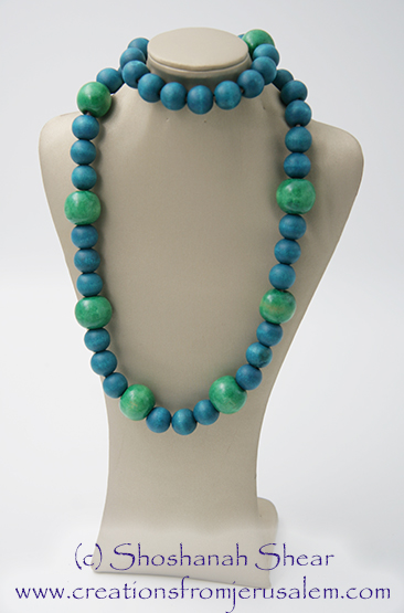 Green and Turquoise Wooden Bead Necklace on Stand