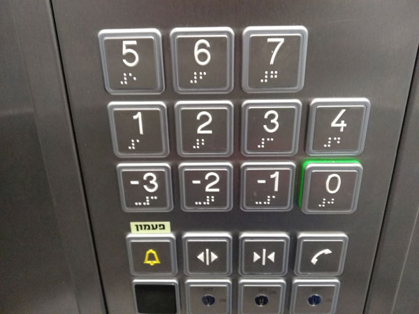 Elevator buttons that include Braille