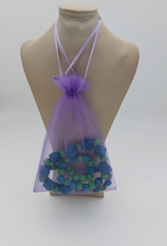 Turquoise and green wooden bead necklace in bag